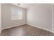 Bedroom featuring hardwood floors, neutral paint, and window views at 6140 Passionate Ct, North Las Vegas, NV 89031
