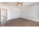 Bedroom showcasing wood-look floors, fan, and neutral paint at 6140 Passionate Ct, North Las Vegas, NV 89031