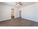 Bedroom featuring wood-look floors with ensuite bathroom access at 6140 Passionate Ct, North Las Vegas, NV 89031