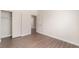 Bright bedroom features wood-look flooring, closet and neutral paint palette at 6140 Passionate Ct, North Las Vegas, NV 89031
