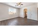 Bedroom with hardwood floors, ceiling fan and bathroom entrance at 6140 Passionate Ct, North Las Vegas, NV 89031