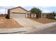 Beautiful single-story house with desert-style landscaping, a spacious driveway, and an attached two-car garage at 6140 Passionate Ct, North Las Vegas, NV 89031