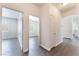 Bright hallway featuring wood-look floors and access to multiple rooms at 6140 Passionate Ct, North Las Vegas, NV 89031