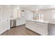 Spacious kitchen with stone countertops, stainless appliances, and a central island at 6140 Passionate Ct, North Las Vegas, NV 89031