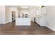 Open kitchen with stainless appliances, white cabinets, an island, and eat in area at 6140 Passionate Ct, North Las Vegas, NV 89031