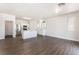 Modern kitchen with laminate flooring, stainless steel appliances, and sleek white cabinets at 6140 Passionate Ct, North Las Vegas, NV 89031