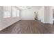 Inviting living room area with laminate flooring, recessed lighting, and abundant natural light at 6140 Passionate Ct, North Las Vegas, NV 89031