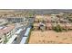 Aerial view of a residential community with rows of homes, apartments, and covered parking in a desert landscape at 6247 Sugartree Ave, Las Vegas, NV 89141