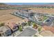 Expansive aerial view of a desert community showcasing homes, apartments and covered parking with mountain views at 6247 Sugartree Ave, Las Vegas, NV 89141