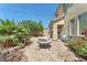 A backyard has a paved patio with a seating area, perfect for outdoor relaxation and entertaining at 6247 Sugartree Ave, Las Vegas, NV 89141