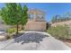 Charming two-story home with a two-car garage and well-maintained landscaping at 6247 Sugartree Ave, Las Vegas, NV 89141