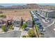 Charming street view with well-kept homes, mature trees, apartments and covered parking in a desert community at 6247 Sugartree Ave, Las Vegas, NV 89141