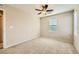 Bedroom features a ceiling fan, carpet flooring and neutral walls at 625 Loyalty Ct, Henderson, NV 89011