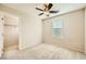 Neutral bedroom featuring a ceiling fan, carpeted floor, and a walk-in closet at 625 Loyalty Ct, Henderson, NV 89011