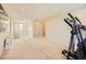 Upstairs bonus room featuring neutral walls, plush carpet, and a fitness machine at 625 Loyalty Ct, Henderson, NV 89011