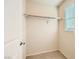 Walk-in closet with a single rack for hanging clothes and a window for light at 625 Loyalty Ct, Henderson, NV 89011