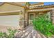 Attractive two-story home with a two-car garage, stone accents, and manicured landscaping at 625 Loyalty Ct, Henderson, NV 89011
