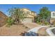 View of a two-story home with a brick driveway, manicured landscaping, and a two-car garage at 625 Loyalty Ct, Henderson, NV 89011