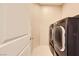 Modern laundry room with a front-loading washer and dryer at 625 Loyalty Ct, Henderson, NV 89011