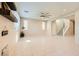 Spacious living room featuring tile floors, a staircase, and natural light from large windows at 625 Loyalty Ct, Henderson, NV 89011