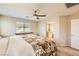 Bright bedroom with ensuite bathroom access and ceiling fan at 625 Loyalty Ct, Henderson, NV 89011