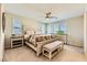 Bedroom with neutral tones, ceiling fan, and ample natural light at 625 Loyalty Ct, Henderson, NV 89011