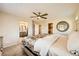 Bedroom features ceiling fan, carpet, and ensuite bath access at 625 Loyalty Ct, Henderson, NV 89011