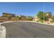 Street view of the neighborhood with well-maintained homes, manicured landscaping, and a cul-de-sac at 625 Loyalty Ct, Henderson, NV 89011