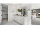 Spacious bathroom featuring double sinks and access to walk-in closet and bedroom at 64 Via Montoro, Henderson, NV 89011