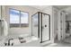 Modern bathroom with soaking tub, glass-enclosed shower, and stylish fixtures at 64 Via Montoro, Henderson, NV 89011