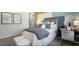Well-designed bedroom with modern decor and a cozy seating area with natural light at 64 Via Montoro, Henderson, NV 89011