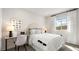 Cozy bedroom featuring a comfy bed, stylish decor, and a bright window view at 64 Via Montoro, Henderson, NV 89011
