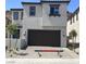 Charming two-story home with a two-car garage and well-maintained landscaping at 64 Via Montoro, Henderson, NV 89011