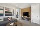 Cozy living room with comfortable seating, entertainment center, and modern decor accents at 64 Via Montoro, Henderson, NV 89011