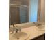 Bathroom featuring double sinks, a spacious vanity top, and a large mirror at 6412 Starling Mesa St, North Las Vegas, NV 89086