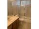 Bathroom with a shower and bathtub with glass doors, plus a vanity at 6412 Starling Mesa St, North Las Vegas, NV 89086