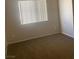 Bedroom with carpeted floor and a window at 6412 Starling Mesa St, North Las Vegas, NV 89086