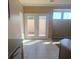Dining area with double doors leading to a spacious patio at 6412 Starling Mesa St, North Las Vegas, NV 89086