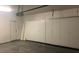 Spacious garage featuring wall cabinets for storing belongings at 6412 Starling Mesa St, North Las Vegas, NV 89086