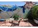 Backyard showcasing a cinder block wall and brick patio with varied plants at 6520 Blooming Sun Ct, Las Vegas, NV 89142