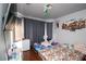 Bedroom featuring wood floors, natural light, and a mini fridge at 6520 Blooming Sun Ct, Las Vegas, NV 89142