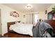 Comfortable bedroom featuring wood floors, ample natural light, and stylish decor at 6520 Blooming Sun Ct, Las Vegas, NV 89142