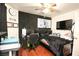 Eclectic bedroom features a black sound-proof accent wall with desk space and mounted TV at 6520 Blooming Sun Ct, Las Vegas, NV 89142