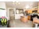 Spacious kitchen with an island and a view into the living room at 6520 Blooming Sun Ct, Las Vegas, NV 89142