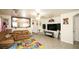 Inviting living room with tiled floors and a decorative mirror reflecting the kitchen at 6520 Blooming Sun Ct, Las Vegas, NV 89142