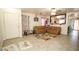 Bright living room with neutral walls, tiled floors and a view leading to the kitchen at 6520 Blooming Sun Ct, Las Vegas, NV 89142