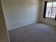 Bedroom featuring neutral carpet, light walls, and natural light from window at 7102 Shimmering Ave, Henderson, NV 89011