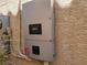 Close-up of a home solar inverter and disconnect switch mounted to an exterior wall at 7102 Shimmering Ave, Henderson, NV 89011