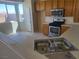 Functional kitchen featuring wood cabinets, stainless steel appliances, and a double basin sink at 7102 Shimmering Ave, Henderson, NV 89011