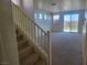 Spacious living room featuring neutral carpet, bright walls, and sliding glass doors to the backyard at 7102 Shimmering Ave, Henderson, NV 89011